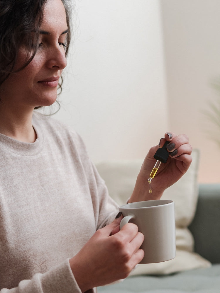 Philip Weeks DIGESTIVE DROPS lady using drops